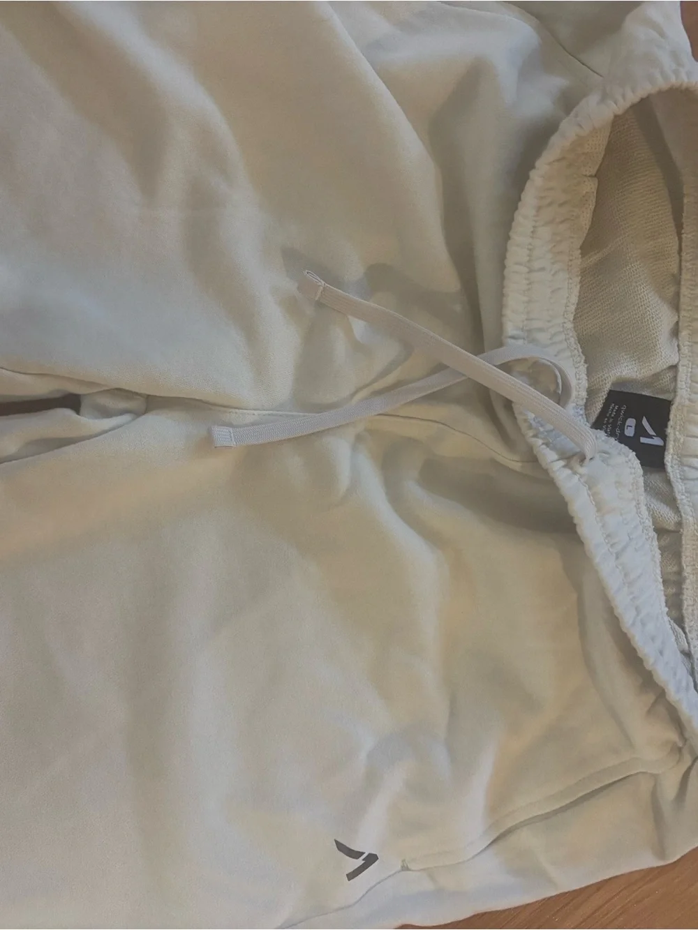 Light Cream Drawstring shorts with Subtle Logo